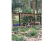 Cozy backyard pergola and garden stone landscaping at 8171 S Homesteader Dr, Morrison, CO 80465