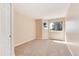 Neutral bedroom with carpeted floors, closet, and bright window with wooded views at 8171 S Homesteader Dr, Morrison, CO 80465