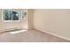 Bright bedroom features a window with wooded views and ample natural light at 8171 S Homesteader Dr, Morrison, CO 80465