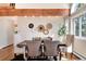 Stylish dining room featuring a modern table, chairs, and decorative wall art at 8171 S Homesteader Dr, Morrison, CO 80465