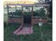 Wooden garden enclosure with a metal gate and a 'Welcome' sign at 8171 S Homesteader Dr, Morrison, CO 80465