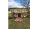 Quaint greenhouse with welcome sign and flower decor at 8171 S Homesteader Dr, Morrison, CO 80465