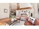 Bright living room with vaulted ceilings, hardwood floors, and a cozy seating area at 8171 S Homesteader Dr, Morrison, CO 80465