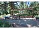 Covered patio with stone pavers and outdoor furniture, perfect for entertaining in a serene setting at 8171 S Homesteader Dr, Morrison, CO 80465