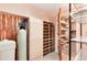Unique wine cellar with custom built wooden racks and shelving provides ample storage for wine and other items at 8171 S Homesteader Dr, Morrison, CO 80465