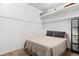 Bedroom featuring neutral-toned carpet and a bed with throw pillows at 7201 E Quincy Ave # 102, Denver, CO 80237