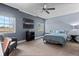 Bedroom featuring two windows, neutral carpet, and a ceiling fan at 7201 E Quincy Ave # 102, Denver, CO 80237