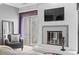 Bright living room with modern fireplace, sliding glass door, and comfortable seating at 7201 E Quincy Ave # 102, Denver, CO 80237