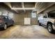 Well-lit parking garage with reserved parking spaces and ample room for vehicles at 7201 E Quincy Ave # 102, Denver, CO 80237