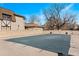 Outdoor pool area with surrounding fence and brick building at 7201 E Quincy Ave # 102, Denver, CO 80237