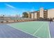 Blue and green tennis court with surrounding fence at 7201 E Quincy Ave # 102, Denver, CO 80237