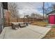 Cozy backyard patio with outdoor seating, a privacy fence, and modern lighting at 3138 N Josephine St, Denver, CO 80205