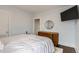 Well-lit bedroom featuring hardwood floors, simple decor, and ample space at 3138 N Josephine St, Denver, CO 80205