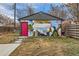 Exterior of garage with a mural and a pink door at 3138 N Josephine St, Denver, CO 80205