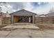 Open detached garage with wood walls, shelving, and workbench provides ample storage and workspace at 3138 N Josephine St, Denver, CO 80205