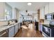 Open-concept kitchen flows seamlessly into the dining and living areas at 3138 N Josephine St, Denver, CO 80205