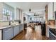 Spacious kitchen with updated appliances and view into dining area at 3138 N Josephine St, Denver, CO 80205