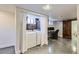 Modern laundry room with stylish barn door, a work space, and front-load washer and dryer at 3138 N Josephine St, Denver, CO 80205