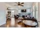 Bright, airy living room with hardwood floors, brick fireplace, and open layout at 3138 N Josephine St, Denver, CO 80205