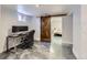 Bright office space with a barn door and a view to the bedroom at 3138 N Josephine St, Denver, CO 80205
