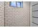 Bright shower with white subway tiles, dark grout, and a window at 3138 N Josephine St, Denver, CO 80205