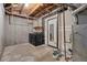 Unfinished basement with washer/dryer hookups and utilities, ready to be personalized at 19216 E Idaho Pl # 102, Aurora, CO 80017
