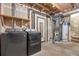 Unfinished basement with washer/dryer hookups and utilities, ready to be personalized at 19216 E Idaho Pl # 102, Aurora, CO 80017