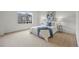 Spacious bedroom with large window, carpet floors, and stylish decor at 19216 E Idaho Pl # 102, Aurora, CO 80017