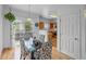 Inviting dining area with glass table and access to a deck at 19216 E Idaho Pl # 102, Aurora, CO 80017