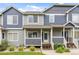Charming townhome featuring a welcoming entrance with well-manicured landscaping at 19216 E Idaho Pl # 102, Aurora, CO 80017
