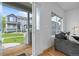 Bright living room with stylish decor, hardwood floors and a view of the front yard at 19216 E Idaho Pl # 102, Aurora, CO 80017