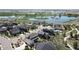 Aerial view showcasing a neighborhood near a lake and walking trails at 4526 Colorado River Dr, Firestone, CO 80504