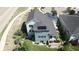 Back exterior shows spacious yard, solar panels, and an inviting covered patio at 4526 Colorado River Dr, Firestone, CO 80504