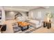 Basement featuring neutral walls, carpet and an oversized sectional sofa with a table at 4526 Colorado River Dr, Firestone, CO 80504