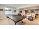 Basement featuring neutral walls, carpet, ping pong table and a staircase to the main level at 4526 Colorado River Dr, Firestone, CO 80504