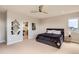 Cozy bedroom features sleek decor, modern fan, and plush textures at 4526 Colorado River Dr, Firestone, CO 80504