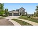Charming two-story home with a well-maintained lawn and a three-car garage at 4526 Colorado River Dr, Firestone, CO 80504