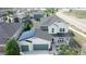 Stylish two-story home with modern design, solar panels, two-car garage, and lovely front porch at 4526 Colorado River Dr, Firestone, CO 80504
