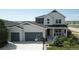 Inviting two-story home with a spacious three-car garage and a basketball hoop at 4526 Colorado River Dr, Firestone, CO 80504
