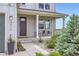 Charming front porch with a seating area, and lovely landscaping at 4526 Colorado River Dr, Firestone, CO 80504