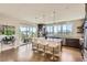 Modern kitchen featuring stainless steel appliances, a large island with seating, and ample natural light at 4526 Colorado River Dr, Firestone, CO 80504