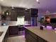 Contemporary kitchen with stainless steel appliances, quartz countertops, and dark wood cabinetry at 4526 Colorado River Dr, Firestone, CO 80504