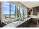 Bright kitchen with a large window overlooking the backyard at 4526 Colorado River Dr, Firestone, CO 80504