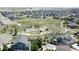 Aerial view shows community park with playgrounds and green space within the neighborhood at 4526 Colorado River Dr, Firestone, CO 80504