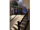 Elegant staircase featuring ambient lighting and dark wood banisters at 4526 Colorado River Dr, Firestone, CO 80504