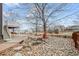 Backyard with stone landscaping and a deck at 7112 E 131St Pl, Thornton, CO 80602