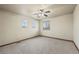 Simple bedroom with ceiling fan and carpet flooring at 7112 E 131St Pl, Thornton, CO 80602