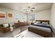 Bedroom with a queen bed, dresser, and ceiling fan at 7112 E 131St Pl, Thornton, CO 80602