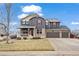 Two story house with front yard, driveway and landscaping at 7112 E 131St Pl, Thornton, CO 80602