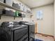 Laundry room with shelving, washer, and dryer at 7112 E 131St Pl, Thornton, CO 80602